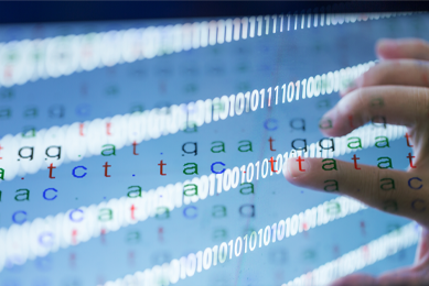 Color-coded letters, DNA binary data sequences with a hand touching the letters.