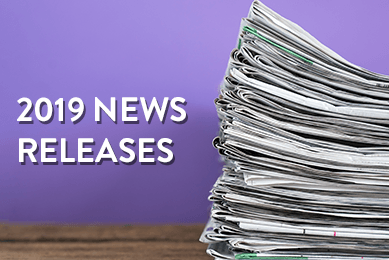 Stack of newspapers with text  on a purple background that says 2019 News Releases.