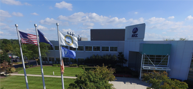 ATCC headquarters building and "ATCC" sign and flags in Manassas, Virginia.