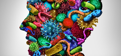 Microbes and bacteria in bright colors combined to form the shape of a human head. Illustration.