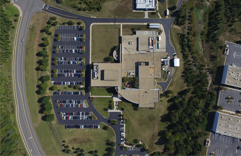 Aerial view of ATCC headquarters building roof and parking lot in Manassas, Virginia.