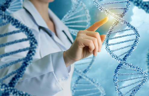 Strands of blue and white-beaded DNA double helixes floating in the air upright, with a woman in a lab coat touching a strand and light illuminating it.