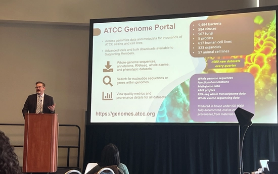 Jonathan Jacob presents an ATCC Genome Portal overview at the World Vaccine Congress 2026 meeting, with a slide behind showing genomic datasets, organism counts, and features such as whole-genome sequencing, RNA‑seq, and quality metrics.