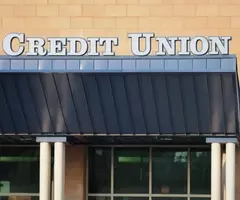 Storefront with a sign that reads credit union over the awning.