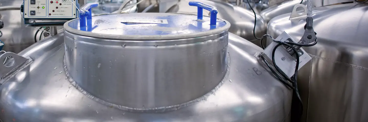 Close-up of cryopreservation tank lid in biorepository.