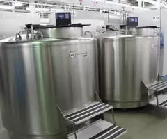 Room full of liquid nitrogen cryopreservation tanks at biorepository.